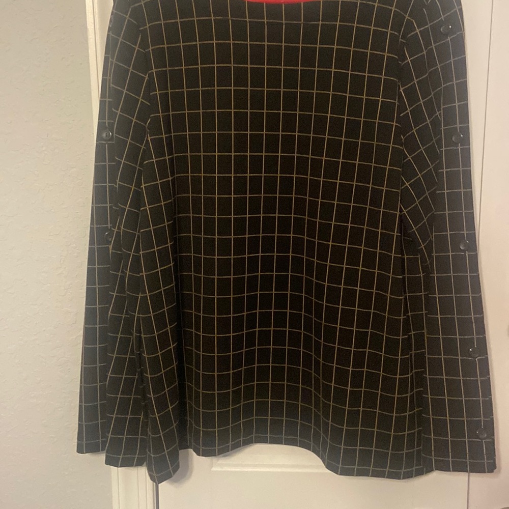 A checkered patterned black blouse